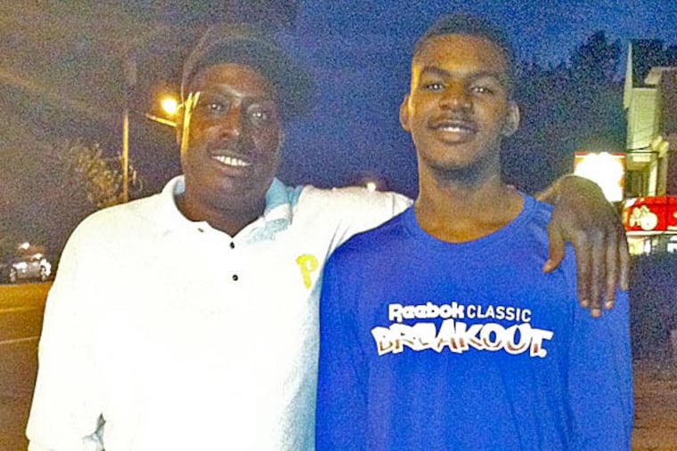 Lewis Lloyd (left) and son Andre Adams at Reebok Breakout Classic. (Tyler R. Tynes/Staff)