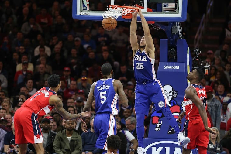 Ben Simmons dunks against the Wizards during the third quarter.