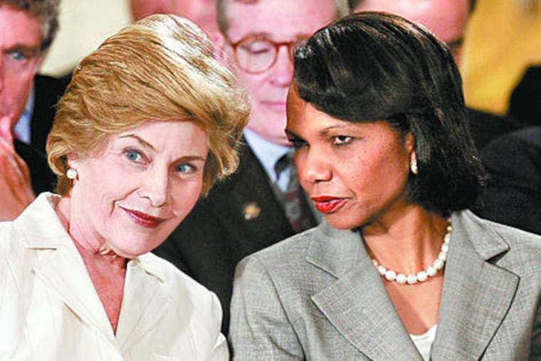 "History will judge," Laura Bush, with Secretary of State Condoleezza Rice in 2005, said of her husband's presidency. Both women defended the president's legacy against critics.