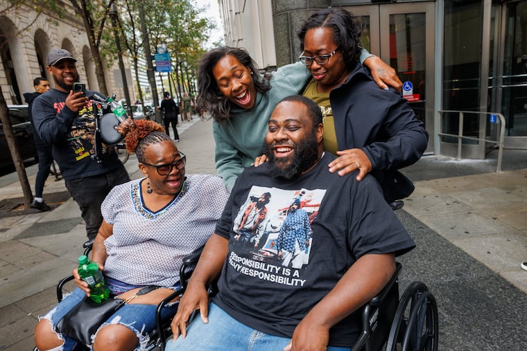 Tyree Musier with his mother Annette (left) and sisters Tamira and Tania outside the Philadelphia courthouse shortly after he was released from custody after spending 17 years in prison for a murder he said he didn't commit.