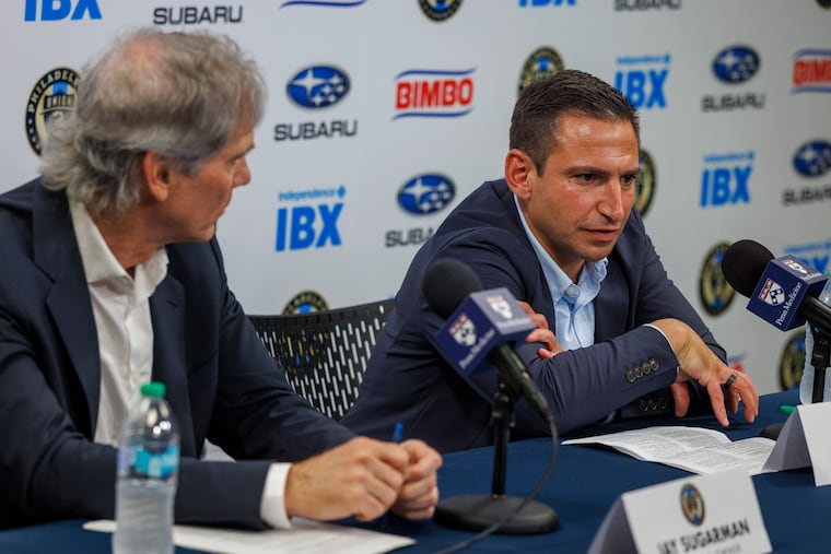 Union owner Jay Sugarman (left) listens to new Union sporting director Jon Scheer during an introductory press conference on Thursday.