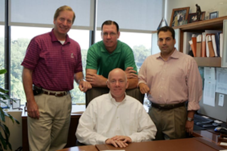 Managers of Radnor-based NewSpring Capital: Michael DiPiano (seated) with (standing, from left) Glenn T. Rieger, Marc Lederman, and Jonathan S. Schwartz.