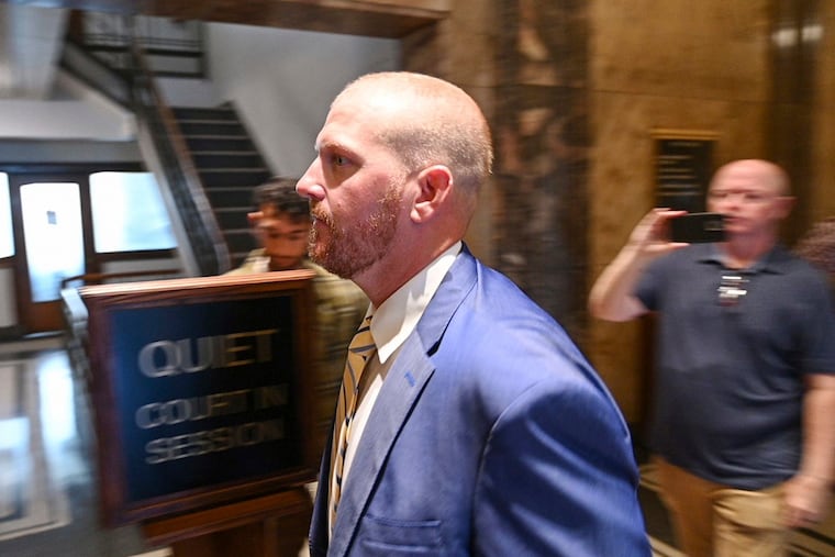 Former Kansas City Chiefs assistant coach Britt Reid walks to a courtroom at the Jackson County Courthouse in September in Kansas City, Mo.