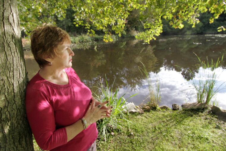 The Kirkwood Lake in Voorhees is in Alice Johnston's backyard. She was photographed there on September 26, 2013. ( ELIZABETH ROBERTSON / Staff Photographer )