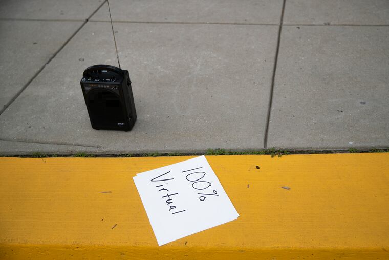 A sign sits outside of the Philadelphia School District Headquarters during a rally held by teachers, principals and others on Saturday, July 25, 2020. The District pivoted its plan from hybrid to all-virtual after outcry from community members.