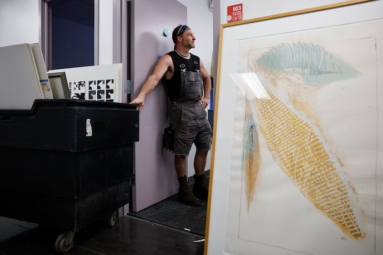 George Mathes, owner of Thunderbird Salvage, stands inside a room with art work on the sixth floor of the former UArts’ Anderson Hall along South Broad Street on Thursday, July 31, 2025.