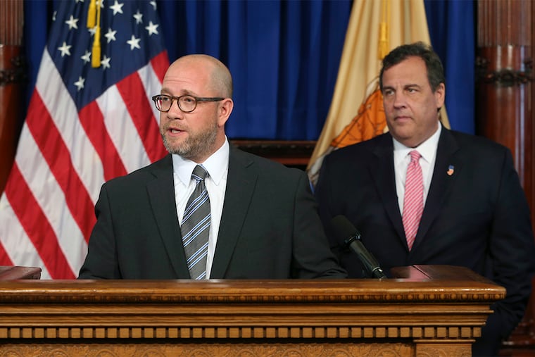 As New Jersey Gov. Chris Christie, right, looks on, his former chief counsel Chris Porrino addresses a gathering after Christie named him the state's new attorney general Thursday, June 16, 2016, in Trenton, N.J.
