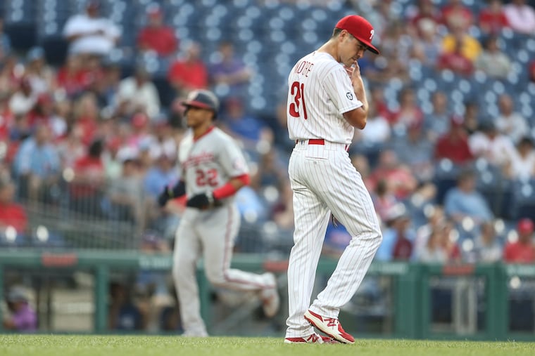 Phillies pitcher Matt Moore walks back to the mound after serving up a three-run homer to the Nationals' Juan Soto after he rounds third base in the background during the second inning at Citizens Bank Park in Philadelphia, Tuesday, July 27, 2021