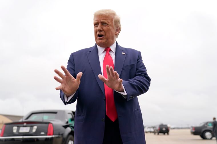 President Donald Trump speaks to the media before boarding Air Force One for a trip to Kenosha, Wis., on Tuesday.