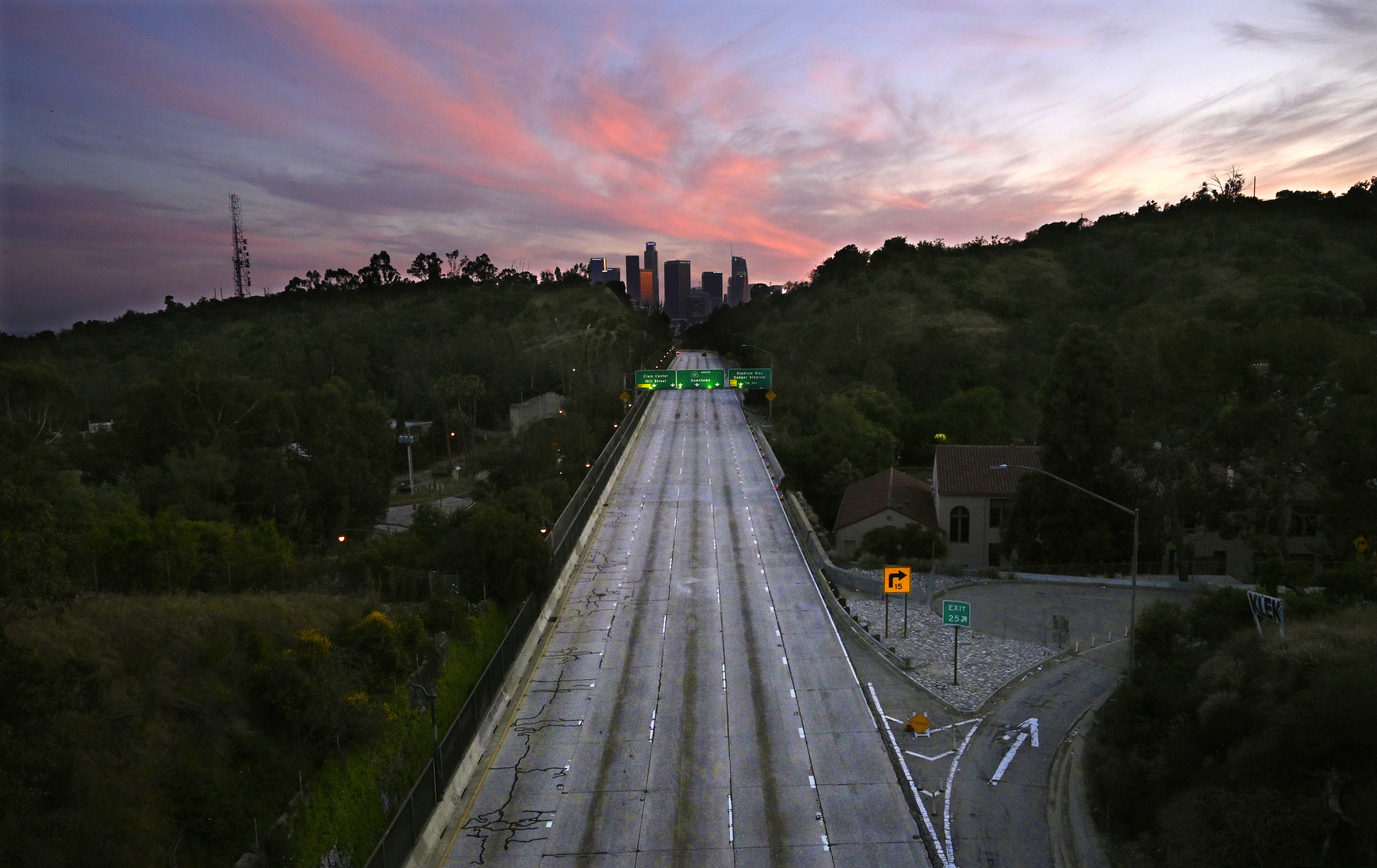 In this April 26 photo, empty lanes of the 110 Arroyo Seco Parkway that leads to downtown Los Angeles is seen during the coronavirus outbreak in Los Angeles. The world cut its daily carbon dioxide emissions by 17% at the peak of the pandemic shutdown last month, a new study found. But with life and heat-trapping gas levels inching back toward normal, the brief pollution break will likely be “a drop in the ocean" when it comes to climate change, scientists said.