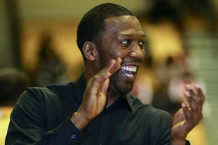 ML King's head coach Sean Colson very happy with his team against
Math, Civics & Science during the 4th quarter during Public League
semifinals action, Tuesday, February 18, 2014. MLK wins 75-56. (
Steven M. Falk / Staff Photographer )