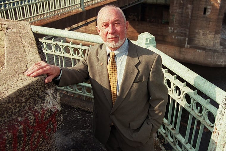 Mr. Grenald poses on the bank of the Schuylkill for a 1999 Inquirer story about his long career.