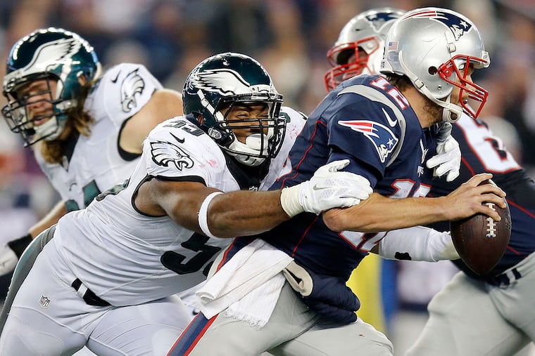 Brandon Graham sacks New England Patriots quarterback Tom Brady.