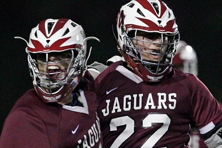 Garnet Valley's Matt Taulane, left, celebrates with Brandon Down after his
winning OT goal against Radnor in District I Semi-Finals at Radnor
High School on Tuesday, May 21. (Ron Cortes/Staff Photographer)