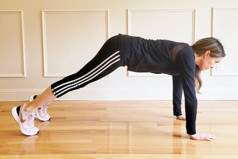 Ashley demonstrates improper plank form with hips hiked up too high.