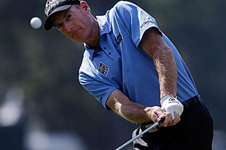 Jim Furyk shot a 6-under 64, giving him a 1-shot lead at the Tour Championship. (John Bazemore/AP)