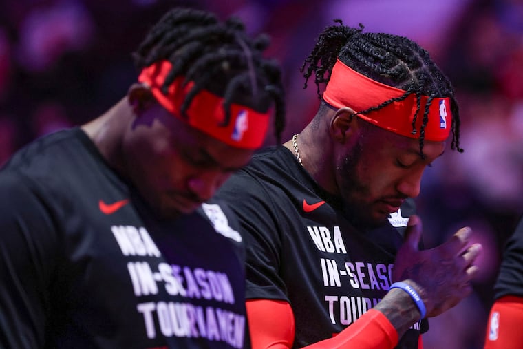 Sixers forward Robert Covington (right) and Danuel House Jr. before the game against the Cleveland Cavaliers on Nov. 21.