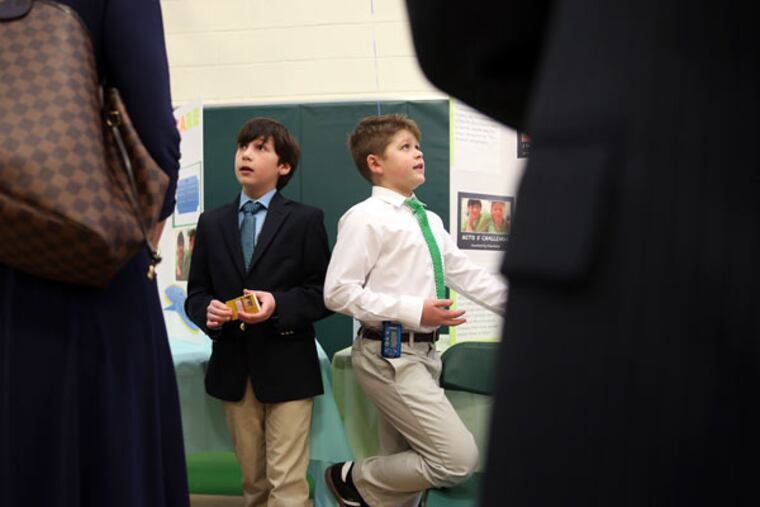 Brett Mezrow (left) and Niels Strautnieks hope their “Mito 5 Challenge” goes viral the way the ALS Ice Bucket Challenge did. (DAVID MAIALETTI / Staff Photographer)