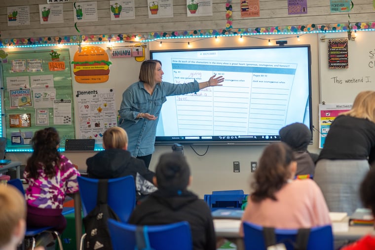 Teacher Mari Zuber points to the board while working with her fourth-grade class in January at Neidig Elementary in Quakertown.