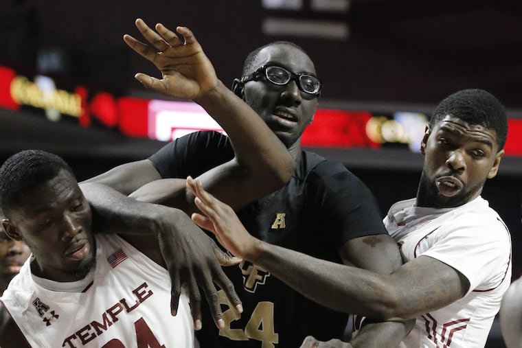 UCF's 7 ft 6 inch # 24 Tacko Fall (center) was often double teamed during the University of Central Florida at Temple University mens basketball game on February 22, 2017. Temple lost 71-69. ELIZABETH ROBERTSON / Staff Photographer