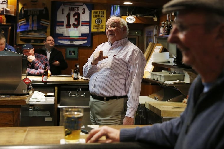 John Stenson talks Eagles fans inside his Eire Pub in Dorchester.