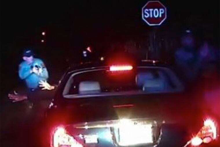 A screenshot of police dash cam video shows Jerame Reid before he was fatally shot by Bridgeton officer Braheme Days during a traffic stop. Days was not indicted, and Reid's family are calling for a federal investigation.