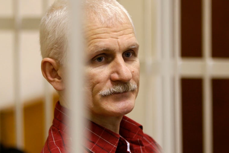 Ales Bialiatski, the head of Belarusian Vyasna rights group, stands in a defendants' cage during a court session in Minsk, Belarus, in November 2011. On Friday he was named one of three recipients of the Nobel Peace Prize.