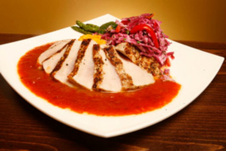 The pork loin, served with mashed sweet potatoes and chipotle barbecue sauce, shows the kitchen's successful side.