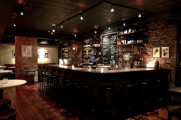 The bar at le Caveau, atop Good King Tavern on Seventh Street below South.