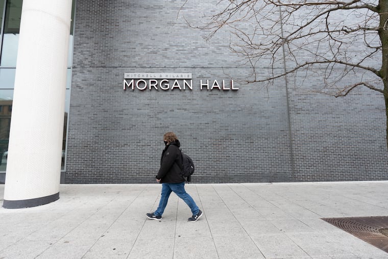 A pedestrian walks past Morgan Hall in this March 23, 2023 file photo. On Sunday, April 19, 2026, a Temple student was chased and attacked inside Morgan Hall student dormitory.