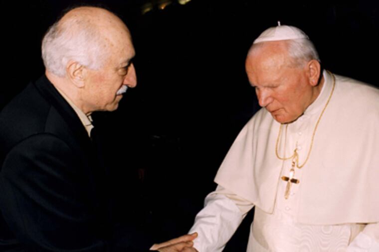Fethullah Gulen and Pope John Paul II at the Vatican in 1998. Gulen, a major Islamic figure in Turkey, lives in the Poconos. He got a green card after touting educational leadership here. (Arturo Mari/AP)