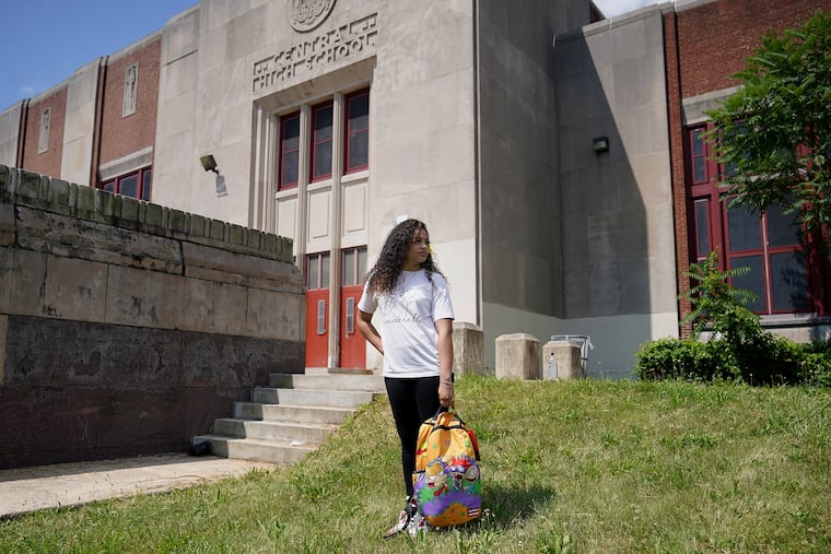 Lynnette Rosario, 19, a senior at Frankford High School, stands for a portrait outside Central High School, her site for summer school classes. When summer school began Monday, Rosario said she was initially sent to the wrong school, made to wait outside for hours, and then given an incomplete roster of classes she needed.