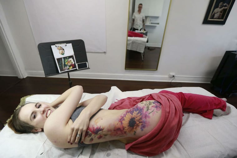 Stephanie Foster has her wedding bouquet tattooed on her side by Pete Zebley at Central Tattoo Studio. She likes his unusual watercolor style.