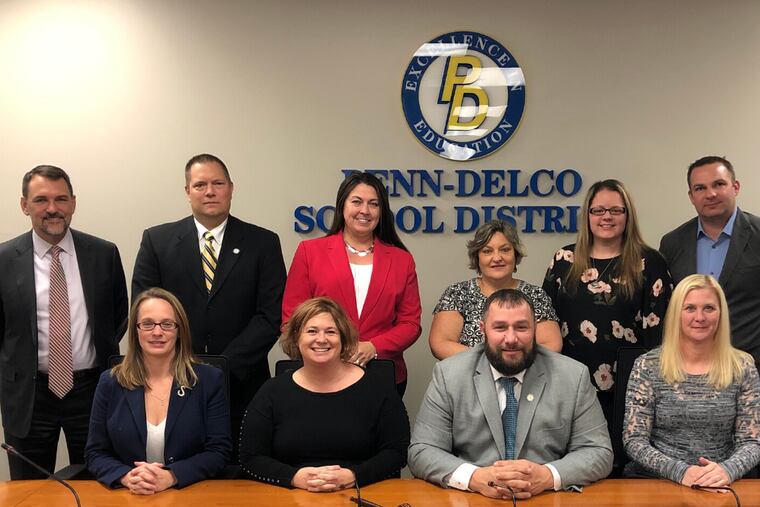 Leon Armour, president of the Penn-Delco School Board (seated, third from left), said his Facebook posts mocking Mexicans and people complaining about police mistreatment "were only meant to be humorous."