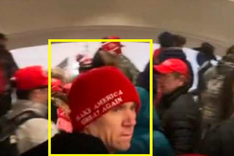 Surveillance footage shows a man federal prosecutors have identified as Ronald Andrulonis, of Philadelphia, passing through the Capitol crypt in Washington during the Jan. 6, 2021, attack on the building.