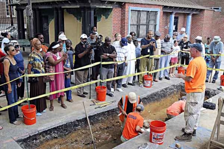 Doug Mooney, Senior Archeologist from URS (right) is explaining a dig to the visiting people including Avenging the Ancestors Coalition at the Weccaco Playground. July 24, 2013( AKIRA SUWA / Staff Photographer )
Archaeologists performing test excavations at site of Mother Bethel burial ground (Weccaco Playground, 4th and Queen) and members of the Avenging the Ancestors Coaltion, active in the President's House controversy, will be on hand to draw attention to the historical importance of the site.