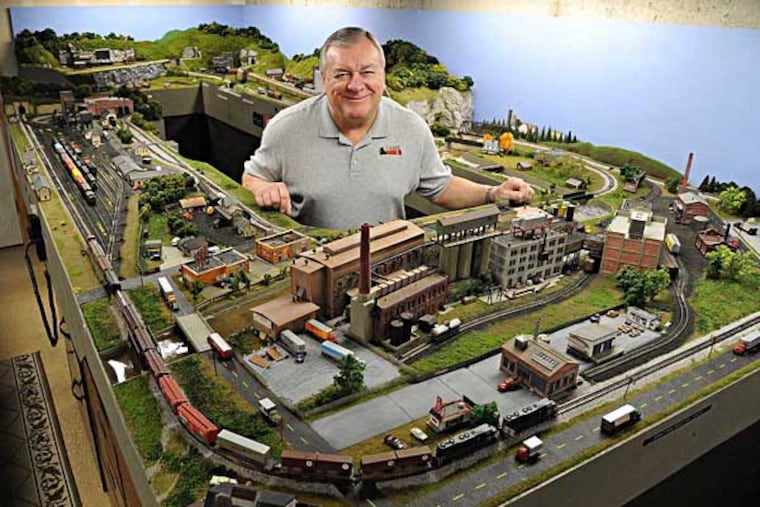 Bob Gross, 67, president of the Glenolden Association of Model Railroaders club, in his basement train room Feb. 27, 2014, which he calls the Mapevale Division of the Pennsylvania Railroad. The 12 x 24 foot layout has 12 N-Scale trains, which are 1/160th size of the real deal. The train club is celebrating its 75th anniversary this year. ( CLEM MURRAY / Staff Photographer )
