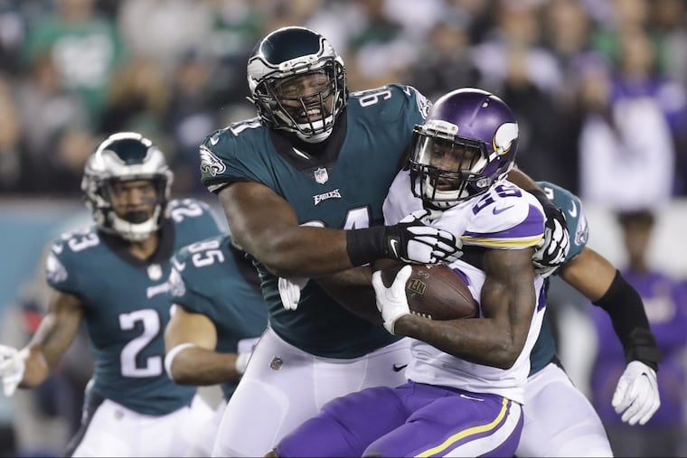 Eagles defensive tackle Fletcher Cox stops Minnesota Vikings running back Latavius Murray in the NFC Championship game on Sunday, January 21, 2018 in Philadelphia.