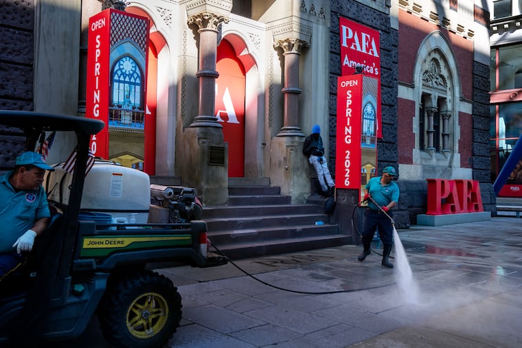 Center City District workers wash the sidewalk in front of the Pennsylvania Academy of the Fine Arts in September.