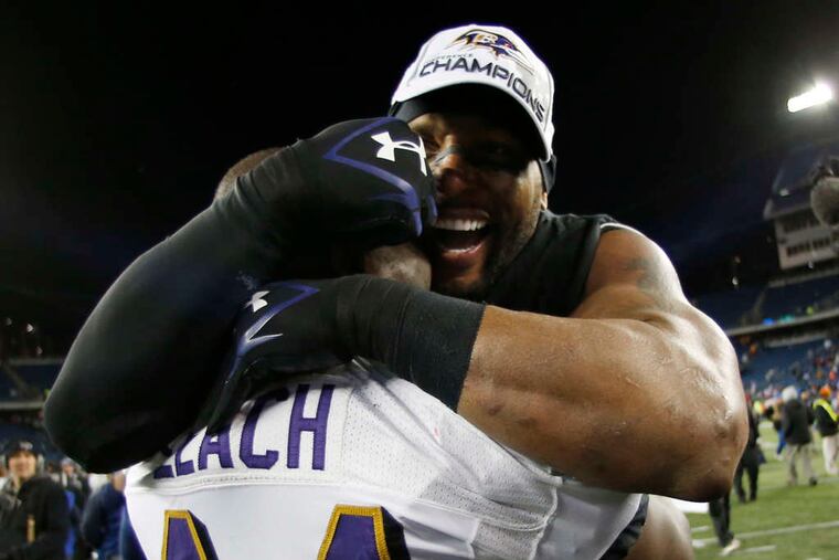 ASSOCIATED PRESS Ray Lewis, Vonta Leach embrace after Ravens' victory.