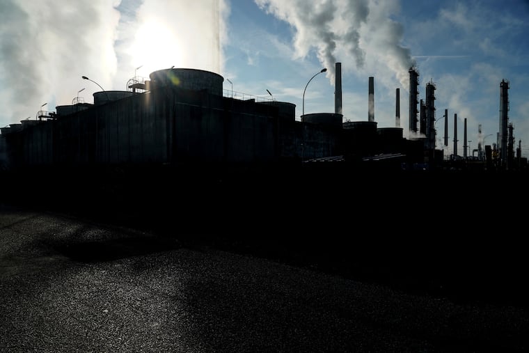 FILE - In this Oct. 15, 2021 file photo, smoke rises from the Feyzin Total refinery chimneys, outside Lyon, central France. The World Meteorological Organization says greenhouse gas concentrations hit a new record high last year and continued to increase at a faster clip than the average rate in the last decade, despite a temporary blip downward amid coronavirus-linked lockdowns. The U.N. weather agency, releasing its flagship annual report on heat-trapping gases in the atmosphere on Monday Oct. 25, 2021, said concentrations of carbon dioxide, methane and nitrous oxide are all above levels in the pre-industrial era pegged to before 1750, when human activities “started disrupting Earth’s natural equilibrium.”