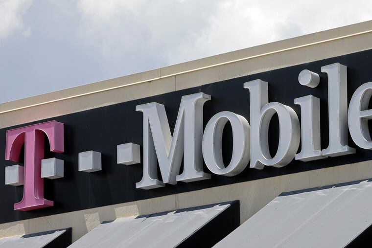 T Mobile sign at a store in Hialeah, Fla. T- Mobile has agreed to pay $350 million, Friday, July 22, 2022, to customers affected by a class action lawsuit filed after the company disclosed last August that personal data like social security numbers had been stolen in a cyberattack.