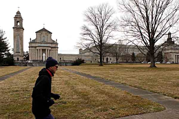 An unidentified man runs on the grounds of Saint Charles Borromeo Seminary off Lancaster Avenue near City Avenue. March 7, 2013. ( MICHAEL S. WIRTZ / Staff Photographer ).