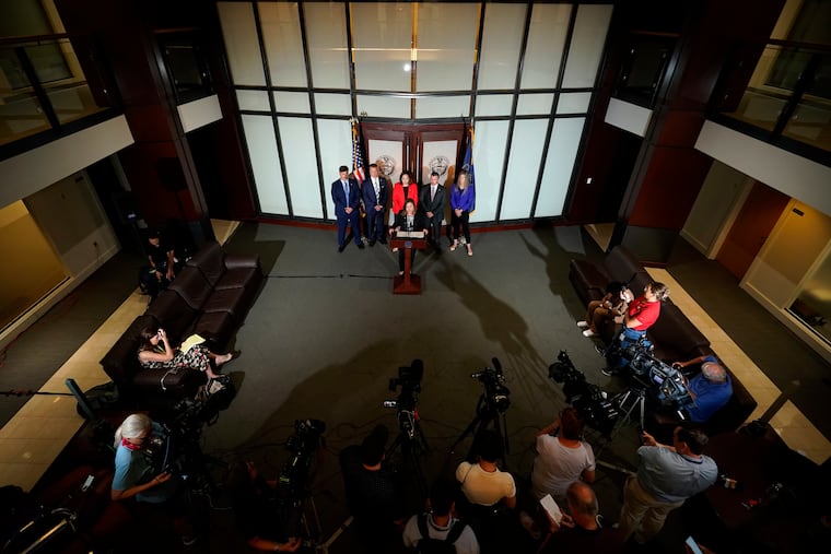 Pennsylvania Attorney General Michelle Henry speaks during a news conference in Philadelphia. A Pennsylvania grand jury investigating child sexual abuse in the Jehovah's Witnesses community has charged another five people with raping or molesting children as young as 4.