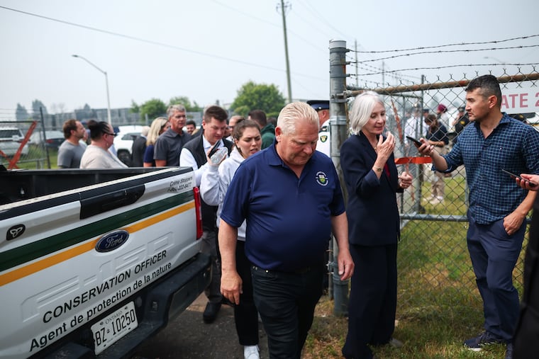 Premier Doug Ford of Ontario leaves after a news conference in Thunder Bay, Ontario, Canada, on Saturday, July 18, 2026. Out-of-control wildfires in Ontario continued to force evacuations and affect major cities in Canada and the United States on Saturday as the province’s leader made his first visit near the devastated area.
