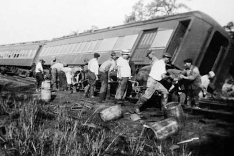 A crew from the Central Railroad of New Jersey works to upright the derailed Blue Comet the day after the wreck on Aug. 19, 1939.