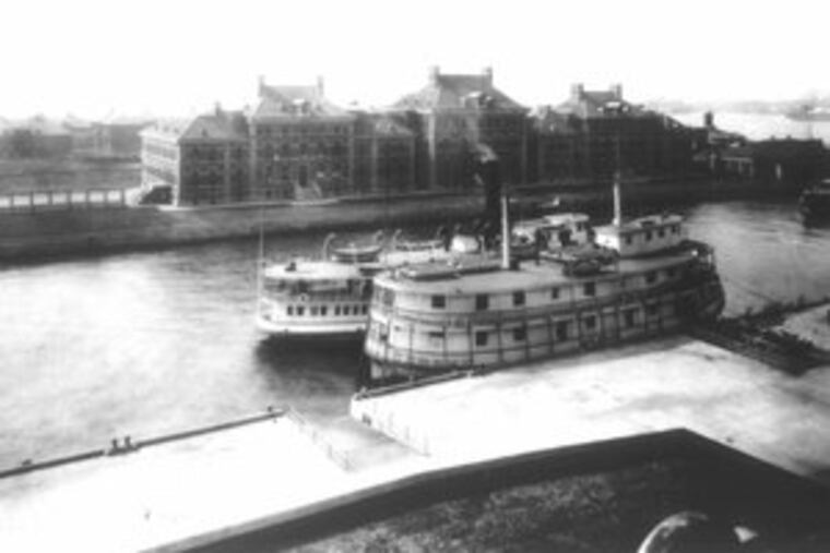 A historic photo shows ferries and clinics at Ellis Island, gateway for about 12 million immigrants. Thirty of these buildings long sat unrestored because of a dispute over which state had sovereignty.