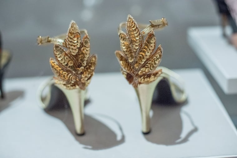 A pair of open toe ankle strap shoes by Stuart Weitzman are on display as part of the Walk This Way exhibit of shoes from Stuart Weitzman's shoe collection Wednesday, December 14, 2022 at Michener Museum in Doylestown, Pennsylvania. WILLIAM THOMAS CAIN / For The Inquirer