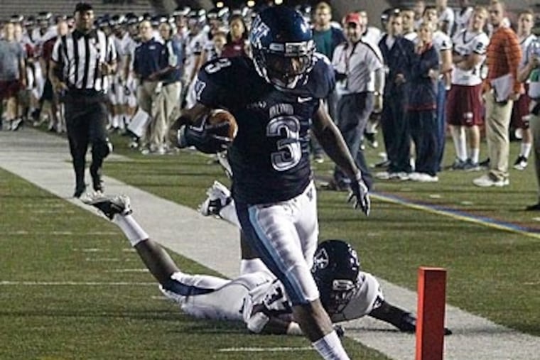 Penn's Evan Jackson cannot stop Villanova's Dorian Wells from scoring in the first half. (Ron Cortes/Staff Photographer)