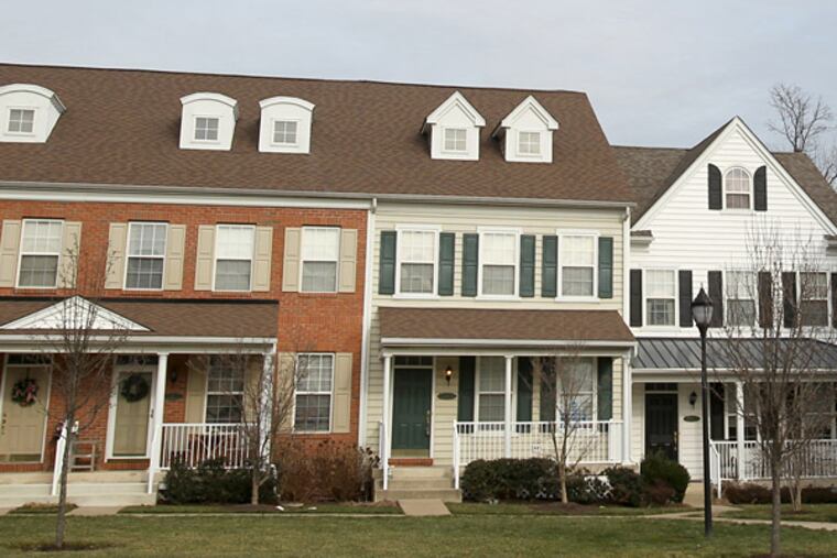 9 Kirkbride Lane, 3rd from left with the tan exterior is for sale in Doylestown. (Charles Fox / Staff Photographer)